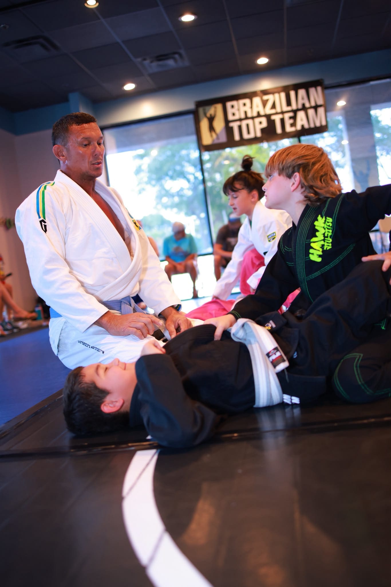 A coach working with the kids class