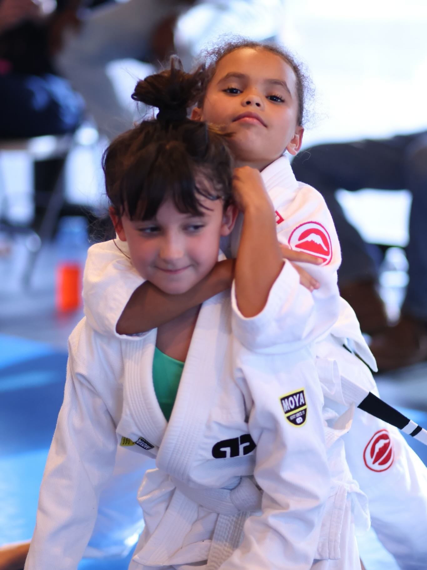 Two young students working a technique in the kids class