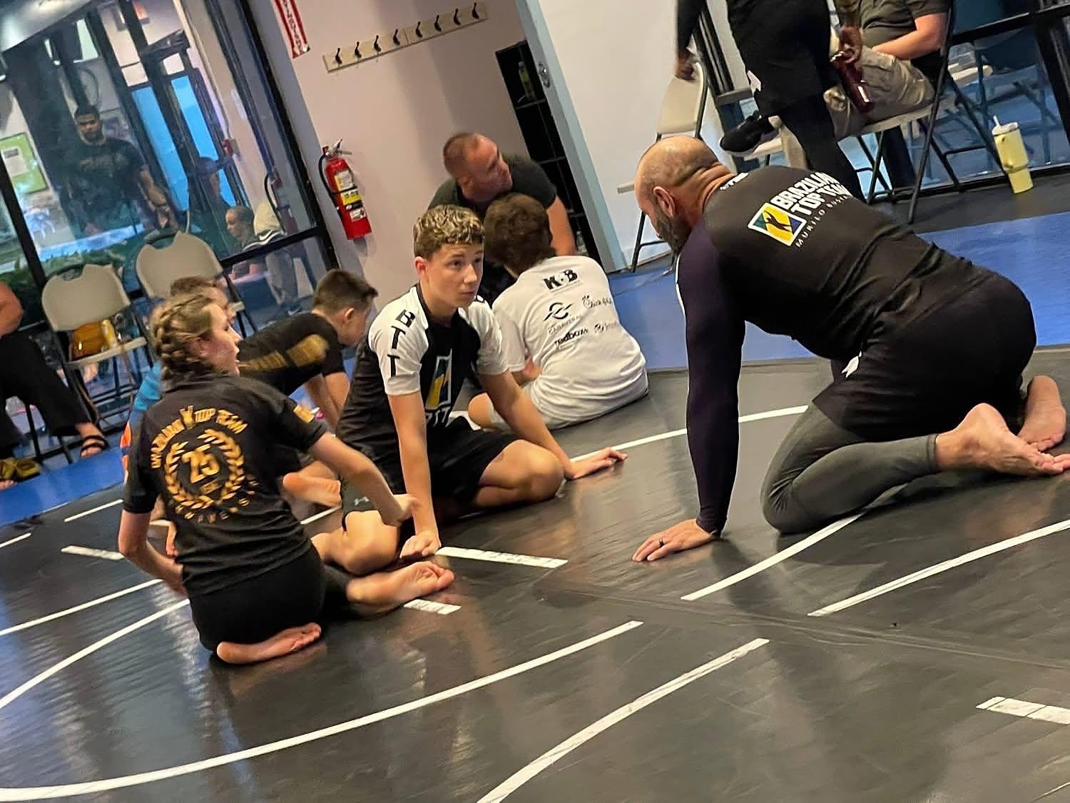 A coach walking the class through a position at BTT Merritt Island