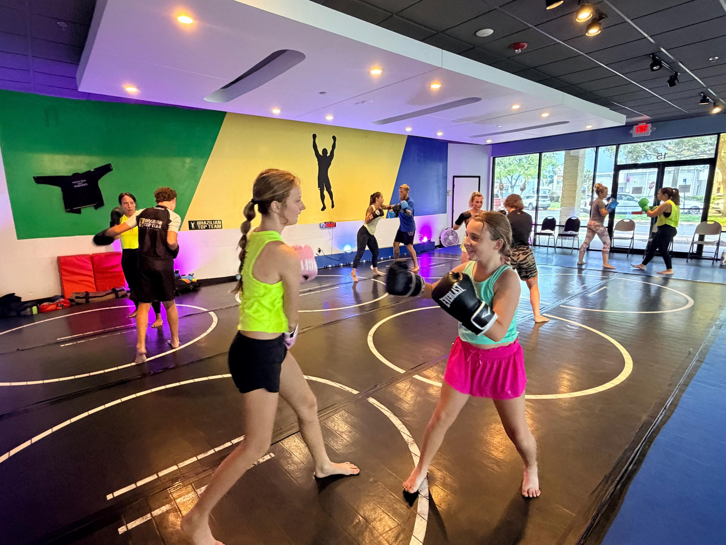 The women's class training across the mats